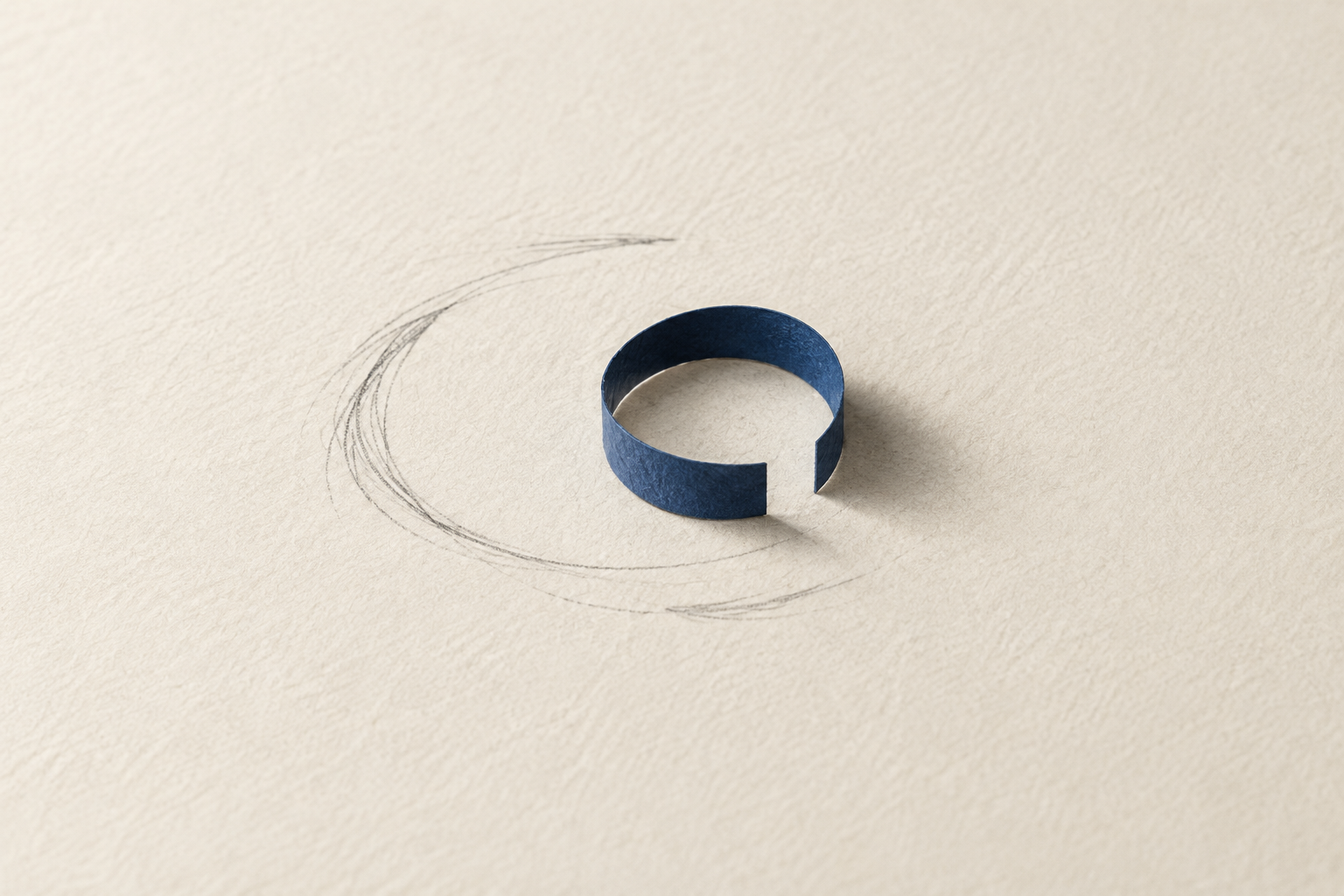 An open loop of blue paper suggests a loading spinner.
