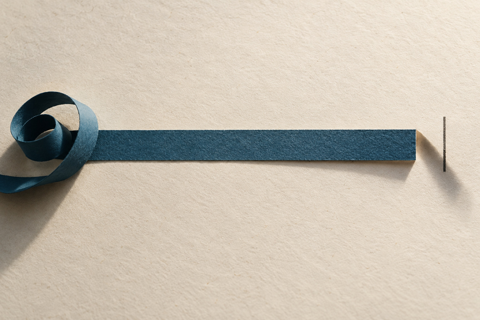A blue paper progress bar nearly reaches its endpoint, leaving a deep shadow in the gap.
