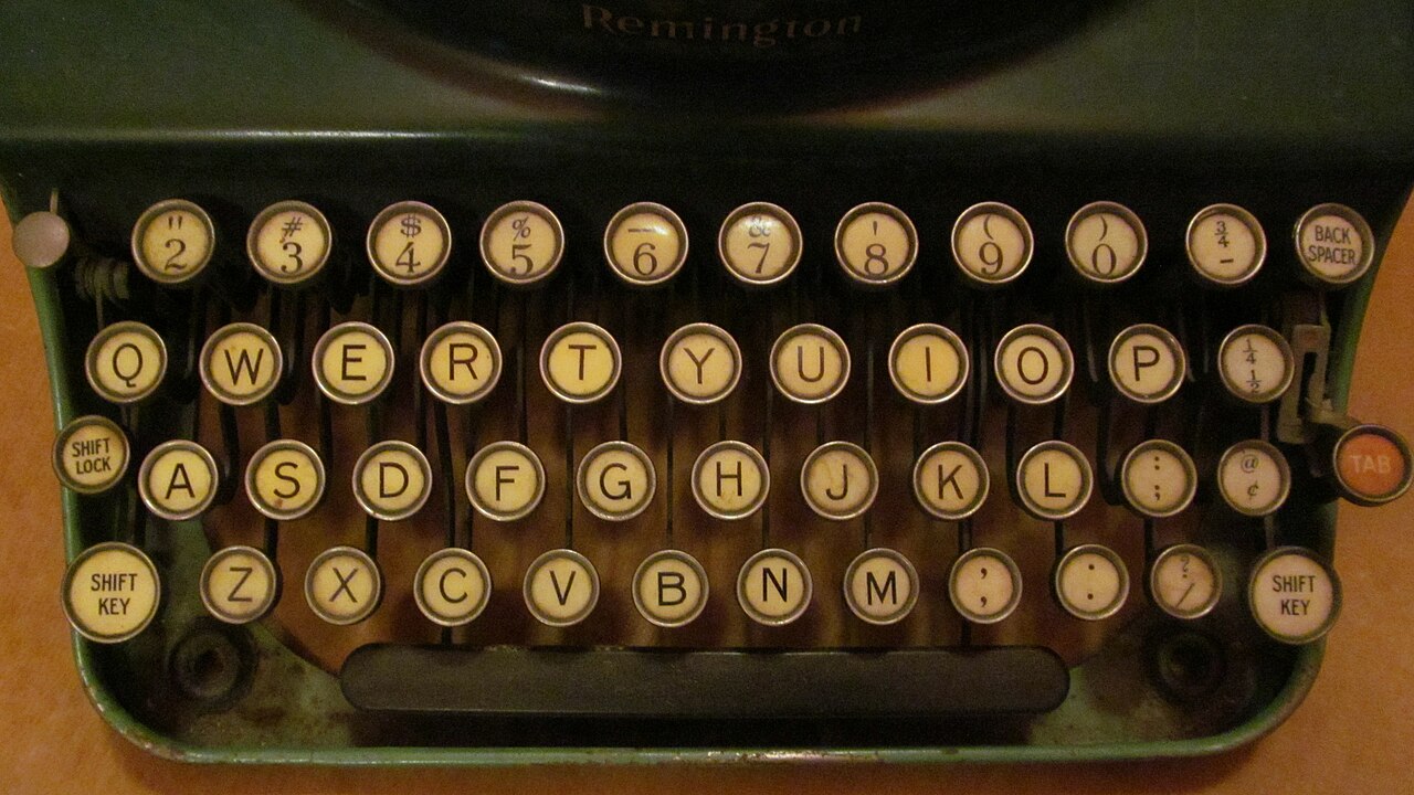 A Remington keyboard with opening and closing parentheses above the 9 and 0 keys.