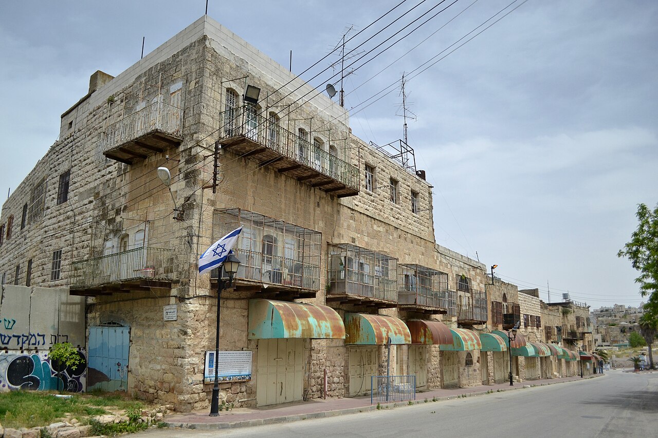 Closed storefronts along Al-Shuhada Street in Hebron.