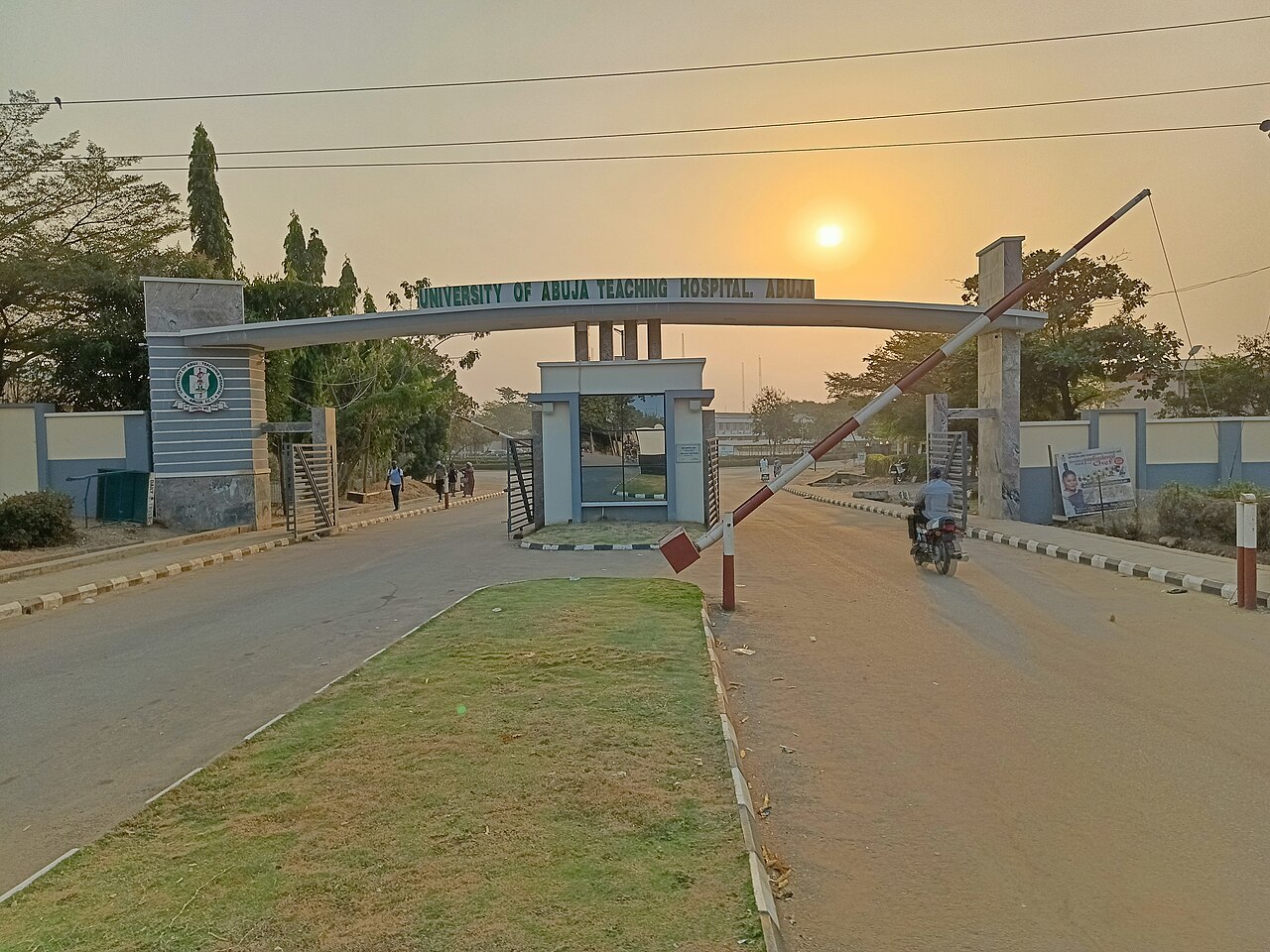 The entrance sign and gate of University of Abuja Teaching Hospital.